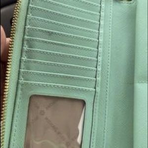 Michael Kors wallet! Resale. It been used for about 6 months Color in mint green